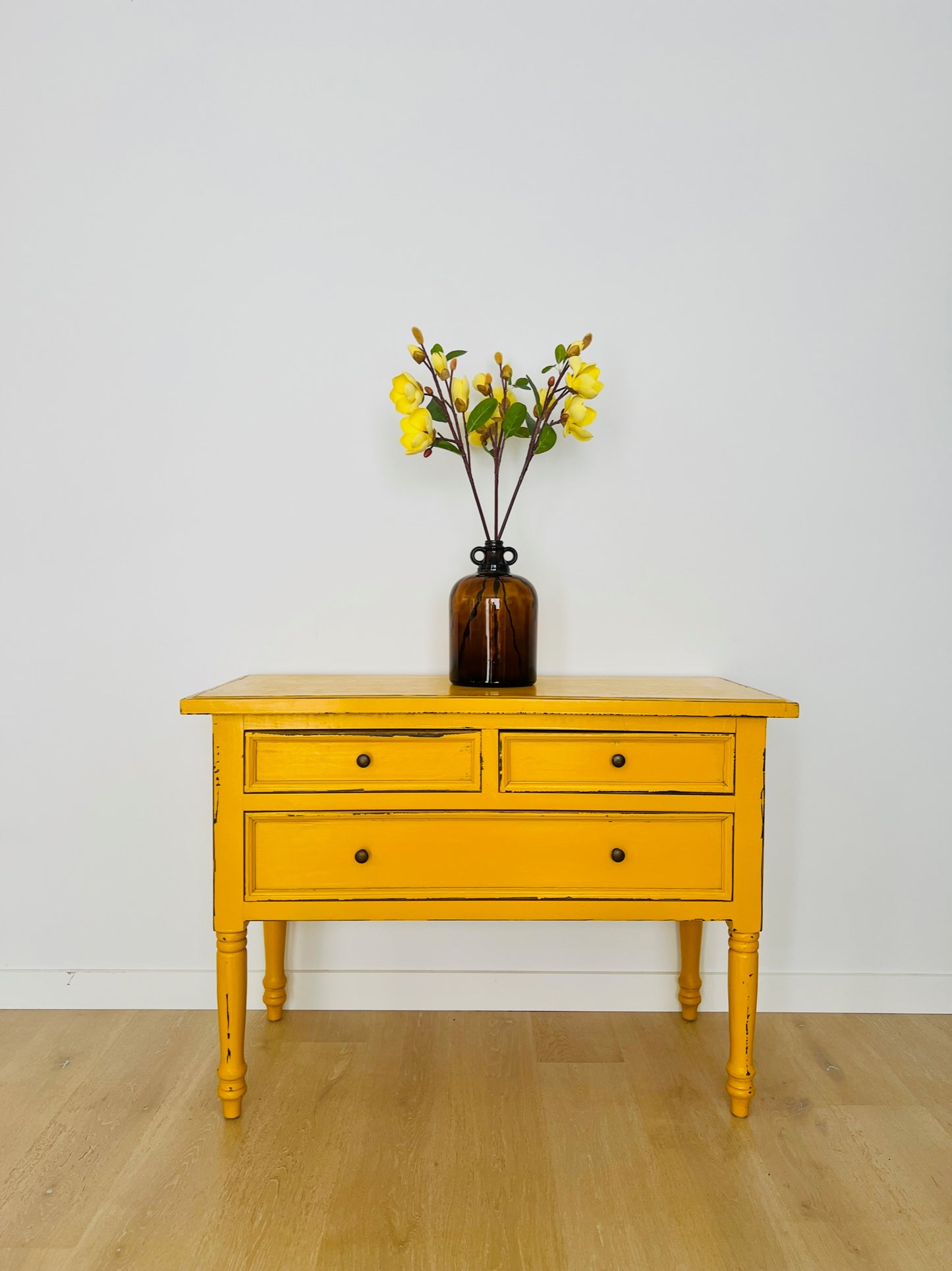 Lovely Amber Jar Vase with Tall Yellow Magnolia Stems