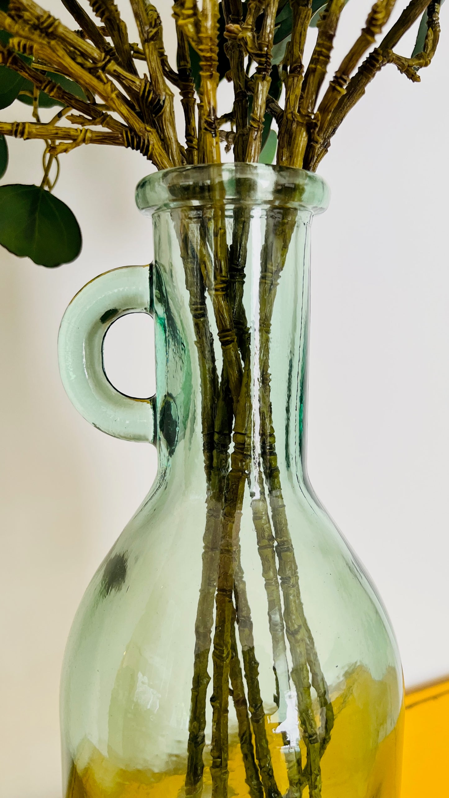 Tall Glass Le Forge Vase with Faux Eucalyptus Branches